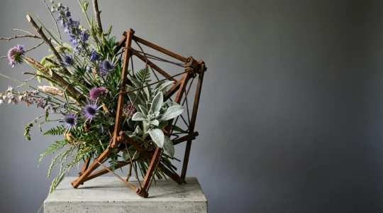 Avant-garde asymmetric floral arrangement breaking traditional round bouquet form
